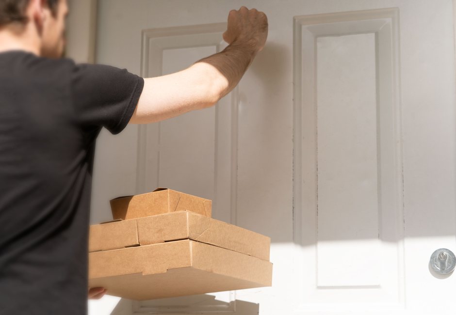 Courier delivering package directly to business partner doorstep